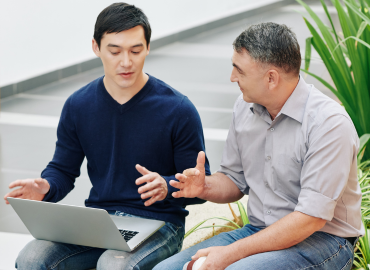 A mentor and mentee in discussion